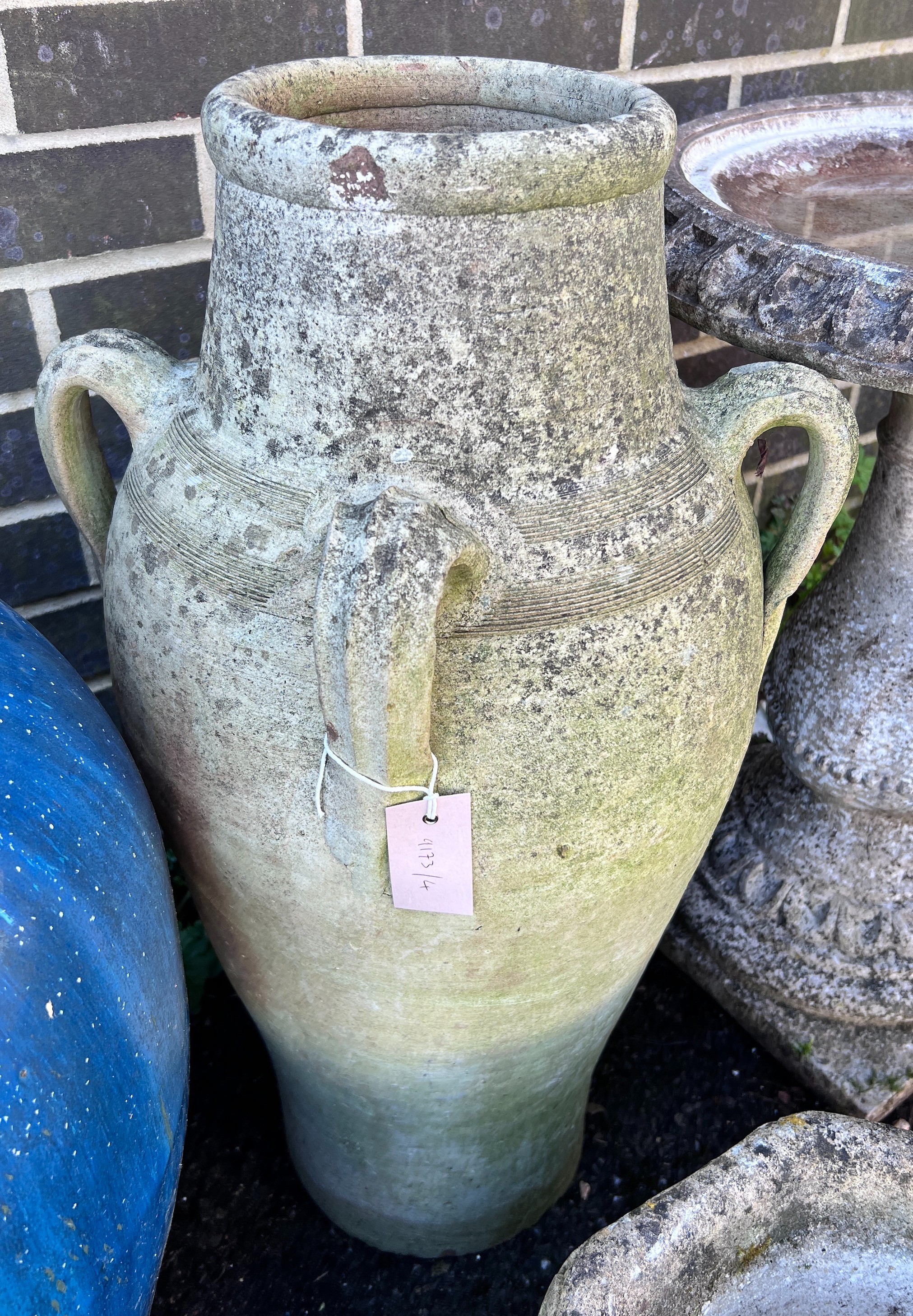 A Greek style earthenware garden urn, height 70cm *Please note the sale commences at 9am.